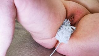 Inserting a brush into her vagina - spread wide open