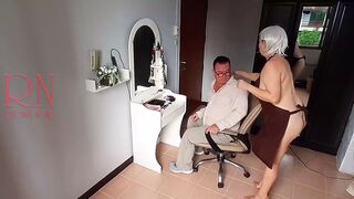 Nudist barbershop. Nude lady hairdresser in an apron makes client to strip. The client is surprised. S1