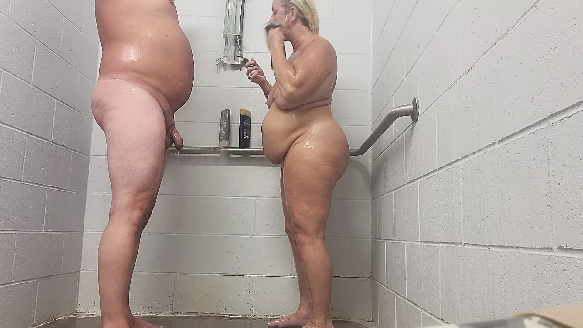 Shower sex with cum in her mouth, after a standing doggystyle session, tits are bouncing ass n thighs are jiggling photo