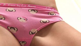 This horny brunette babe gives a private pussy show in her sofa