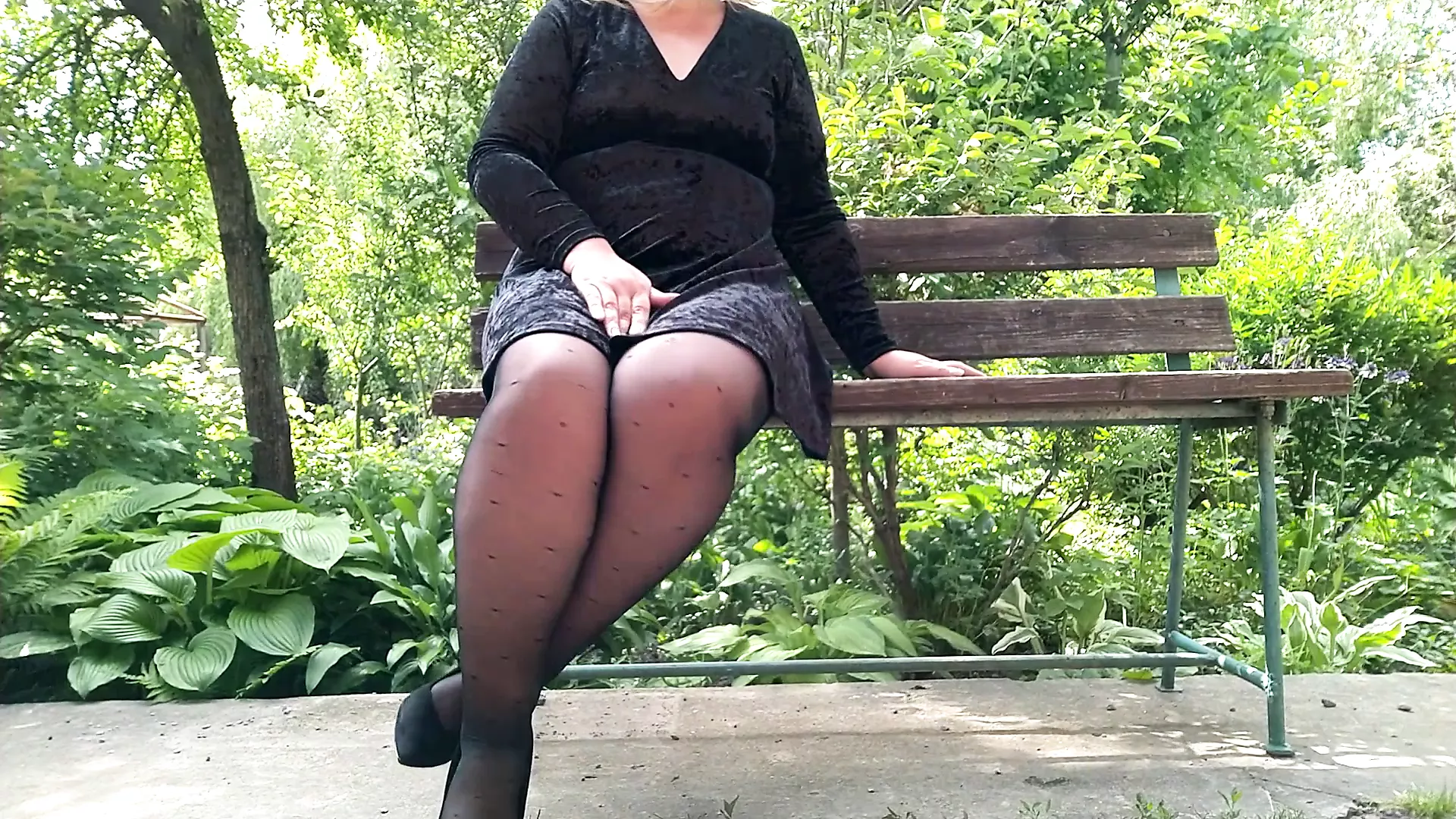 Naughty milf in pantyhose pissing in the park on a bench pic pic