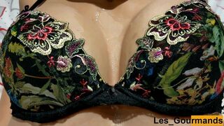 Milf wanks a big cock with oil and makes it cum on her tits