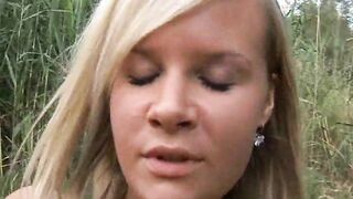 Two sexy blondes masturbating outdoors with dildos