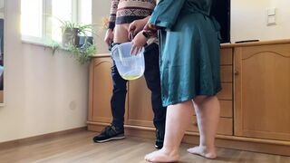 Dear mother-in-law takes off her panties and pees with her legs wide open in a bucket next to her son-in-law