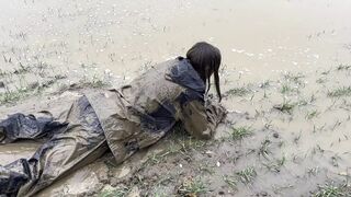 Muddy fields, rain suit in the rain