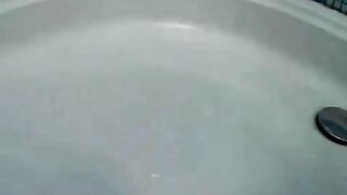 Erotic brunette teen babe Heather teasing with her big jugs and sexy ass in the shower