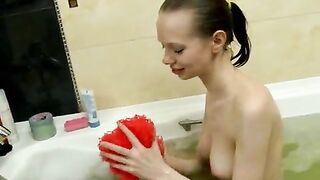 Fervid brunette teenie angel Elise washing her fragile body in the bath tube