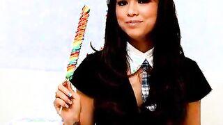 Seductive amateur British schoolgirl Natalia sucking a long lollipop with lust