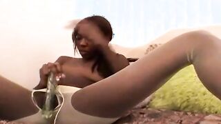 Passionate young black girlfriend in nylons Aisha Anderson playing with a big glass dildo