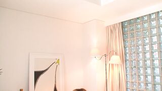 Naughty Asian girl masturbates while she talks on the phone
