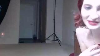 Amateur redhead camgirl with small tits posing on webcam