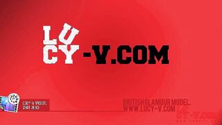 Lucy V in her black fish net top and bottoms outdoors.